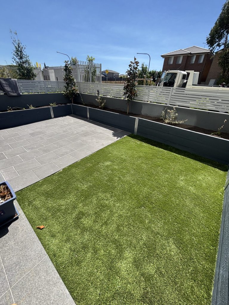 Finished synthetic grass and paver backyard transformation for Terry and Rhonda by Pro Step Landscaping Sydney